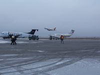 C-GNWN @ CYRT - C-GNWN taking off, Rankin Inlet, NU  2009oct26 with C-FSKN and C-FBPK in foreground - by Philippesdad