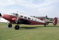 G-BKRN @ EGTC - Beech D18S. At the time this photograph was taken, in 1987, it was in the hands of the Vintage Aircraft Team at Cranfield who preserved it in the condition shown until it was purchased in 1996 for restoration to flying condition by Beech Restorations. - by Malcolm Clarke