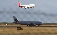 VH-VQO @ BNE - Jetstar Airbus VQO waiting for Qantas VH-VYG - by rkc62