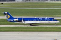 N710BR @ KSAT - Midwest CRJ-200 taxies to its stand