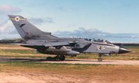 ZA409 @ EGQS - Tornado GR.1B, callsign Jackal 2, of 12 Squadron taxying to the active runway at RAF Lossiemouth in April 1996. - by Peter Nicholson