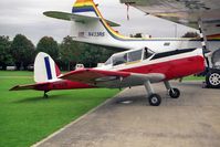 G-BXCV @ EGSU - De Havilland DHC-1 Chipmunk 22 at Duxford Airfield, UK below the wing of Greenpeace's beautiful PBY Catalina N423RS. - by Malcolm Clarke