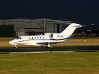 VP-CEG @ EGCC - Cessna 750 Citation 10 departing from RW 23R as the storm clouds roll in - by Chris Hall