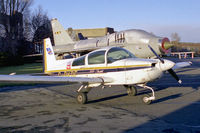 G-BKBE @ EGTC - Grumman American AA-5A Cheetah at Cranfield Airport in 1988. - by Malcolm Clarke