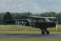 SE-BMC @ ESKD - Mikael Carson demonstrates his Piper Cub at Dala-Järna airfield, Sweden. - by Henk van Capelle