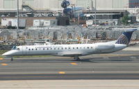 N15910 @ KEWR - One of many CO ExpressJets taxies past the FedEx terminal at Newark. - by Daniel L. Berek