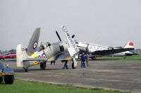 WG655 @ EGTC - Hawker Sea Fury T20S at Cranfield's International Air Fair 1987. Behind is C-47A PH-DDA from the Dutch Dakota Association. - by Malcolm Clarke