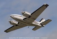 N699PS @ 07FA - Baron Wheels Up at Ocean Reef - by J.G. Handelman