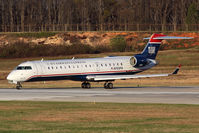 N703PS @ CLT - US Airways Express (PSA Airlines) N703PS taxiing onto RWY 18C for takeoff.