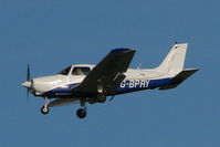 G-BPRY @ EGNX - Piper Cherokee Warrior about to land at East Midlands - by Terry Fletcher