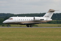 N597DA @ EGGW - Rolling down Runway 26 at Luton. - by MikeP