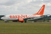 G-EZKC @ EGGW - Rolling down Runway 26. - by MikeP