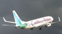 9Y-PBM @ TNCM - Caribbean airlines 9Y-PBM DEPARTING ON RUNWAY 10 WITH SOME HEVY RAIN SHOWERS IN SIGHT - by SHEEP GANG