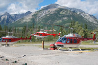 C-GYAA @ CEW9 - C-GYAA between C-GALL and C-GALJ at Alpine Helicopter's Homebase in Canmore - by Tomas Milosch