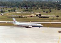 VR-CAA @ TPA - Boeing 737-4Q8 of Cayman Airways taxying to the terminal at Tampa in May 1993. - by Peter Nicholson