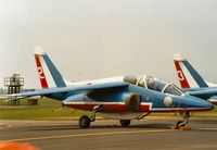 E36 @ MHZ - Alpha Jet regn F-TERC of the Patrouille de France display team on the flight-line at the 1992 Mildenhall Air Fete. - by Peter Nicholson