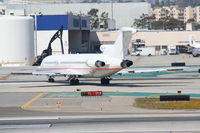 N289MT @ KLAX - Raytheon Boeing 727-223 crossing 25R at Tango KLAX. - by Mark Kalfas