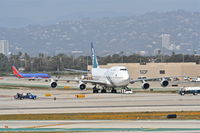 ZK-SUJ @ KLAX - Air New Zealand Boeing 747-4F6, getting a tow to the gate KLAX. - by Mark Kalfas