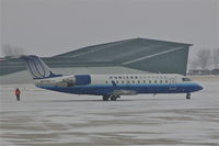 N27185 @ CID - Moving into position for de-icing during light snow - by Glenn E. Chatfield