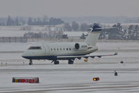 N225N @ CID - Taxiing from PS Air to Runway 27, light snow falling - by Glenn E. Chatfield