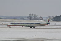 N661JA @ CID - Landing runway 27 during light snow - by Glenn E. Chatfield