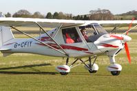 G-CFIY @ EGBO - Part of a busy aviation scene at Wolverhampton (Halfpenny Green) Airport on a crisp winters day - by Terry Fletcher