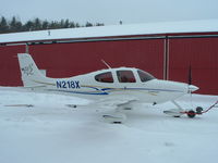 N218X - Cirrus sr22 winter, coming out of the hangar. - by Kevin Reed