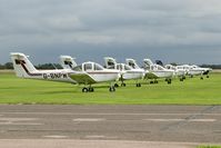 G-BNPM @ EGTC - Piper PA-38-112 Tomahawk at Cranfield Airport in 2006. A quartet of Tomahawks with a brace of Arrows awaiting student pilots. - by Malcolm Clarke