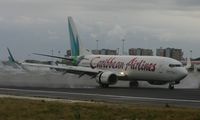 9Y-POS @ TNCM - Caribbean airlines landing on a wet day at TNCM - by Daniel Jef