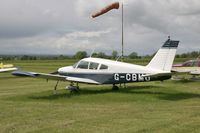 G-CBMO @ EGNG - Piper PA-28-180 Cherokee D at Bagby Airfield in 2006. Previously registered as ZS-ONK. - by Malcolm Clarke