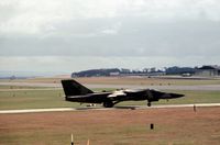 70-2414 @ EGQS - F-111F of 494th Tactical Fighter Squadron/48th Tactical Fighter Wing at RAF Lakenheath preparing to join the active runway at RAF Lossiemouth in the Summer of 1982. - by Peter Nicholson