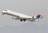 N804SK @ KLAX - SkyWest Bombardier CL-600-2C10,  N804SK, SKW4457 departing 25R KLAX for KSLC. - by Mark Kalfas