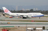B-18211 @ KLAX - China Airlines Boeing 747-409, B-18211, CAL6 arriving from RCTP (Taiwan Taoyuan Int'l) on taxiway Charlie KLAX. - by Mark Kalfas