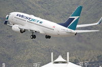 C-FIWJ @ KPSP - WESTJET Boeing 737-7CT, WJA1469 to CYYC, 13R departure KPSP. - by Mark Kalfas