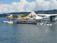 ZK-DXC @ NZLT - With sister aircraft on Lake Taupo jetty - by magnaman