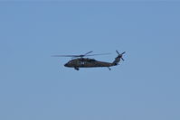 82-23693 @ CID - UH-60 making surveillance by airport prior to Air Force One arrival
