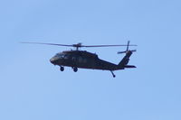 82-23693 @ CID - UH-60 making surveillance by airport prior to Air Force One arrival