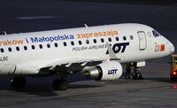 SP-LDC @ LOWW - LOT Polish Airlines 2004 Embraer ERJ-170-100ST, c/n: 17000025 ; Krakow special paint scheme close-up - by Jetfreak