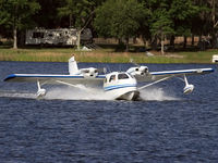 N9508U - Landing on Lake Agnes - by JOE OSCIAK