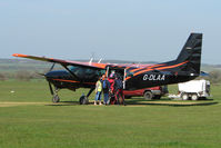 G-DLAA @ EGSP - Cessna Caravan loads up with skydivers on a pleasant day at Peterborough Sibson - by Terry Fletcher