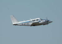 G-ATXD @ EGLK - RESIDENT TWIN COMANCHE CLIMBING OUT FROM RWY 07 - by BIKE PILOT