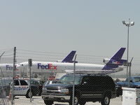 N596FE @ ONT - Parked behind FED EX bldg at ONT near the Airport Police parking area - by Helicopterfriend