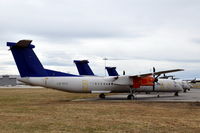 LN-RDA @ ESKN - SAS Commuter Dash 8 400s at Nyköping Skavsta airport in Sweden. These are LN-RDA (in front), LN-RDT and LN-RDP, which are in storage after being taken out of service by SAS after a series of main landing gear collapses. - by Henk van Capelle