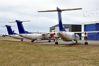 LN-RDA @ ESKN - SAS Commuter Dash 8 400s at Nyköping Skavsta airport in Sweden. These are LN-RDA (in front), LN-RDT and LN-RDP, which are in storage after being taken out of service by SAS after a series of main landing gear collapses. - by Henk van Capelle
