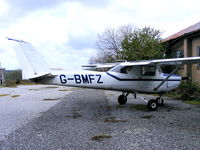 G-BMFZ @ EGLA - Cornwall Flying Club C152 with damage on the tailfin - by Chris Hall