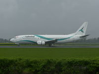 TC-TLA @ EHAM - Tailwind landing 18r on rainy morning - by ghans
