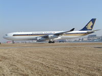 9V-SJN @ ZBAA - Holding short runway