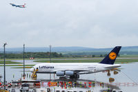 D-AIMA @ VIE - Size comparison: Lufthansa A380 (D-AIMA) with Austrian A320 (OE-LBR) departing. - by Chris J