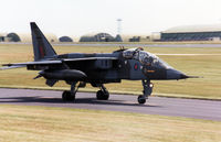 XX139 @ EGQS - Unmarked Jaguar T.2A of 226 Operational Conversion Unit taxying to the active runway at RAF Lossiemouth in the Summer of 1990. - by Peter Nicholson