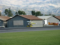 N815AH @ SZP - 2006 Air Creation USA TANARG, Rotax 912ULS 80 Hp tri-blade pusher prop, two-place weight-shift control Experimental class Light Sport aircraft, taxi to hangar. Snow in the Topa Topa mountains in background. - by Doug Robertson